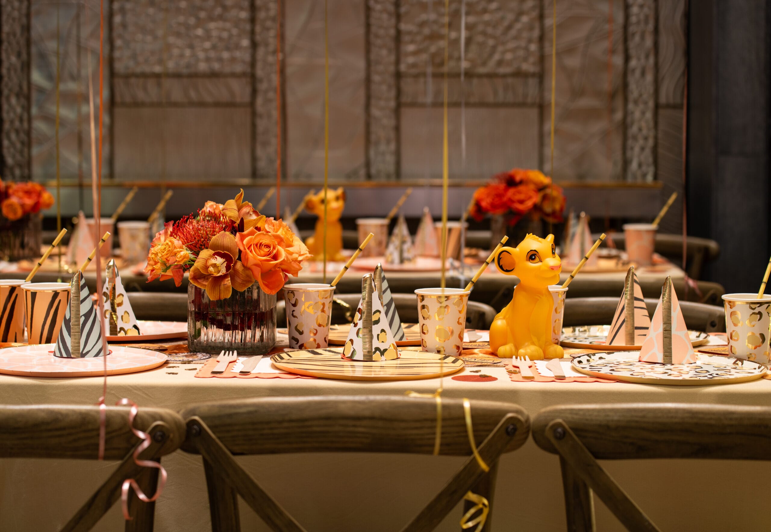 Lion King themed table setting at a children's birthday party in a London hotel