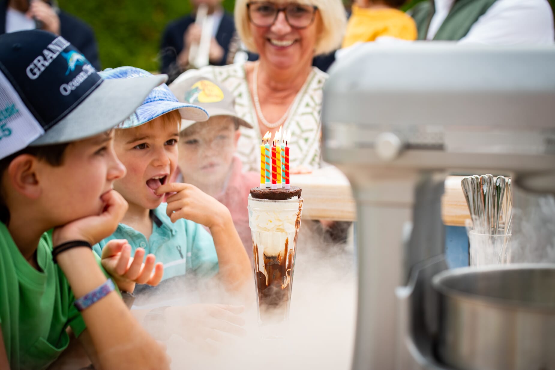 Children gazing at a delicious ice cream - an essential part of a luxury children's party.